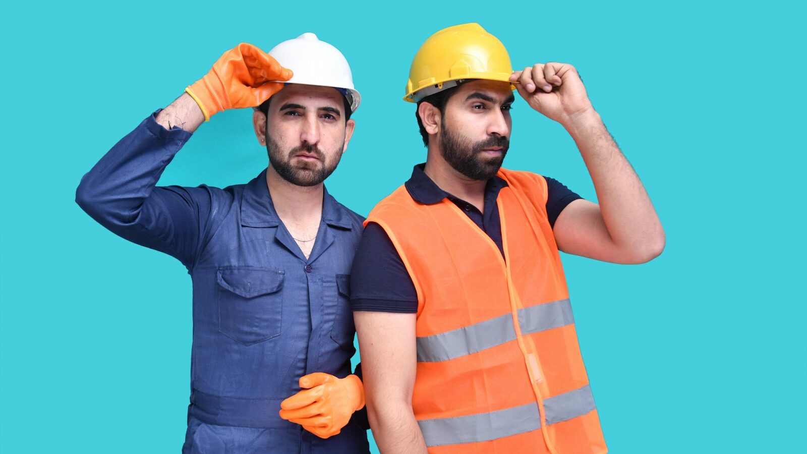 a few men wearing hard hats