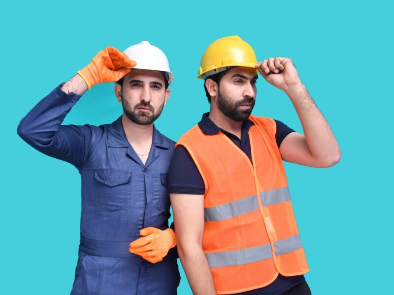 a few men wearing hard hats