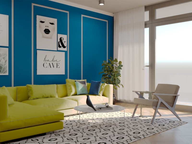 a living room with blue walls and a green couch