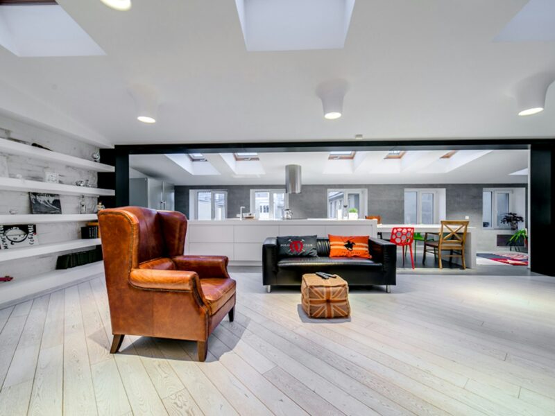 a living room filled with furniture and a fire place