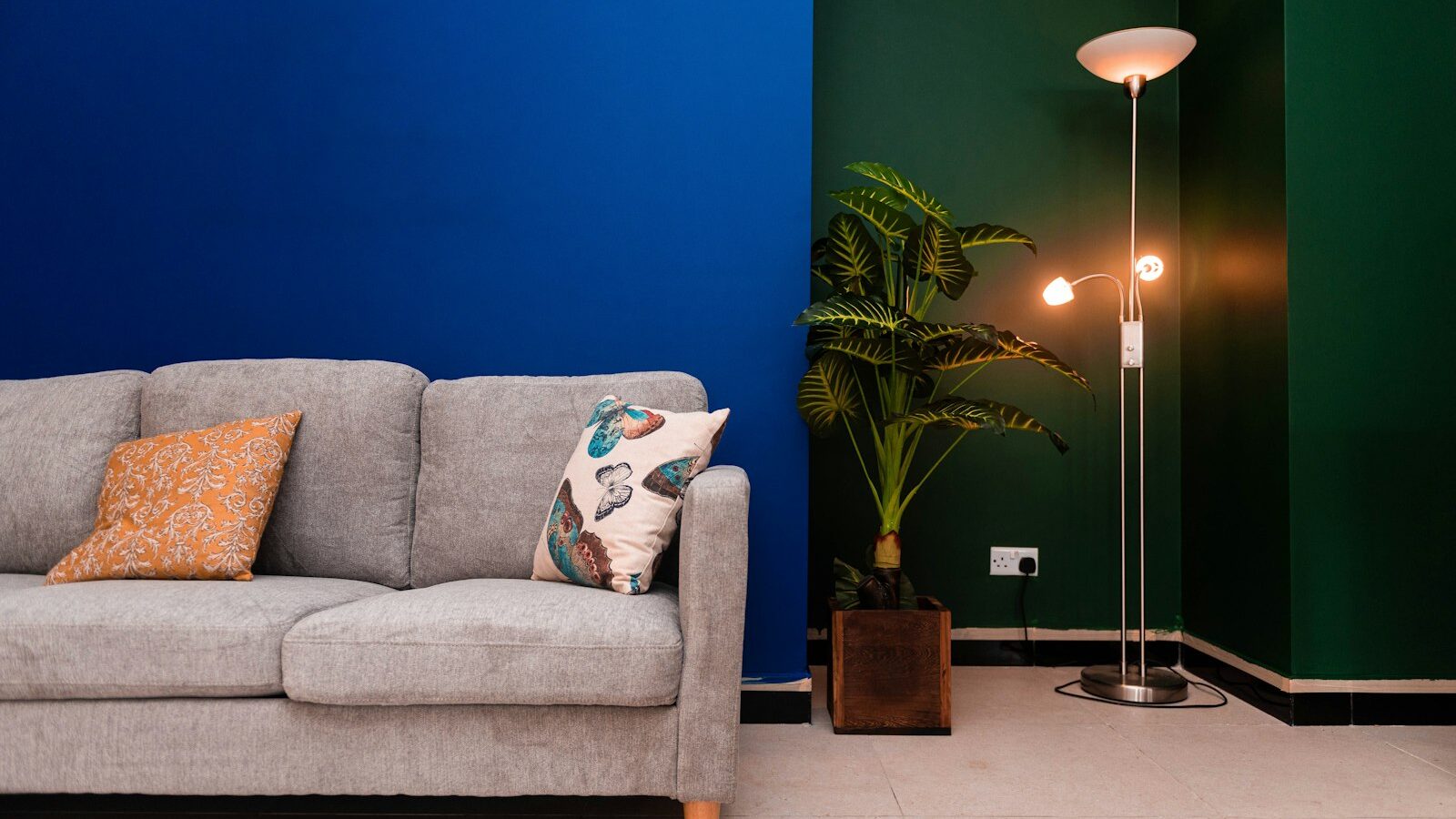 a living room with a couch and a lamp
