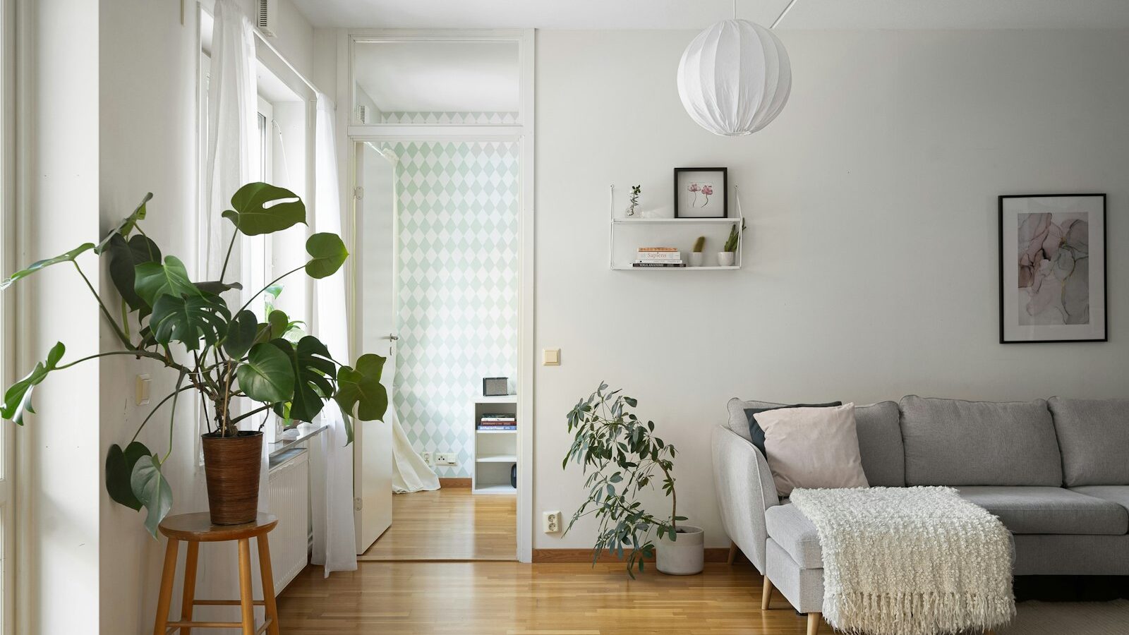 A living room filled with furniture and a wooden floor