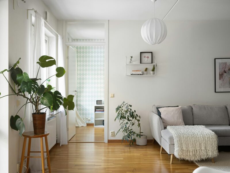 A living room filled with furniture and a wooden floor