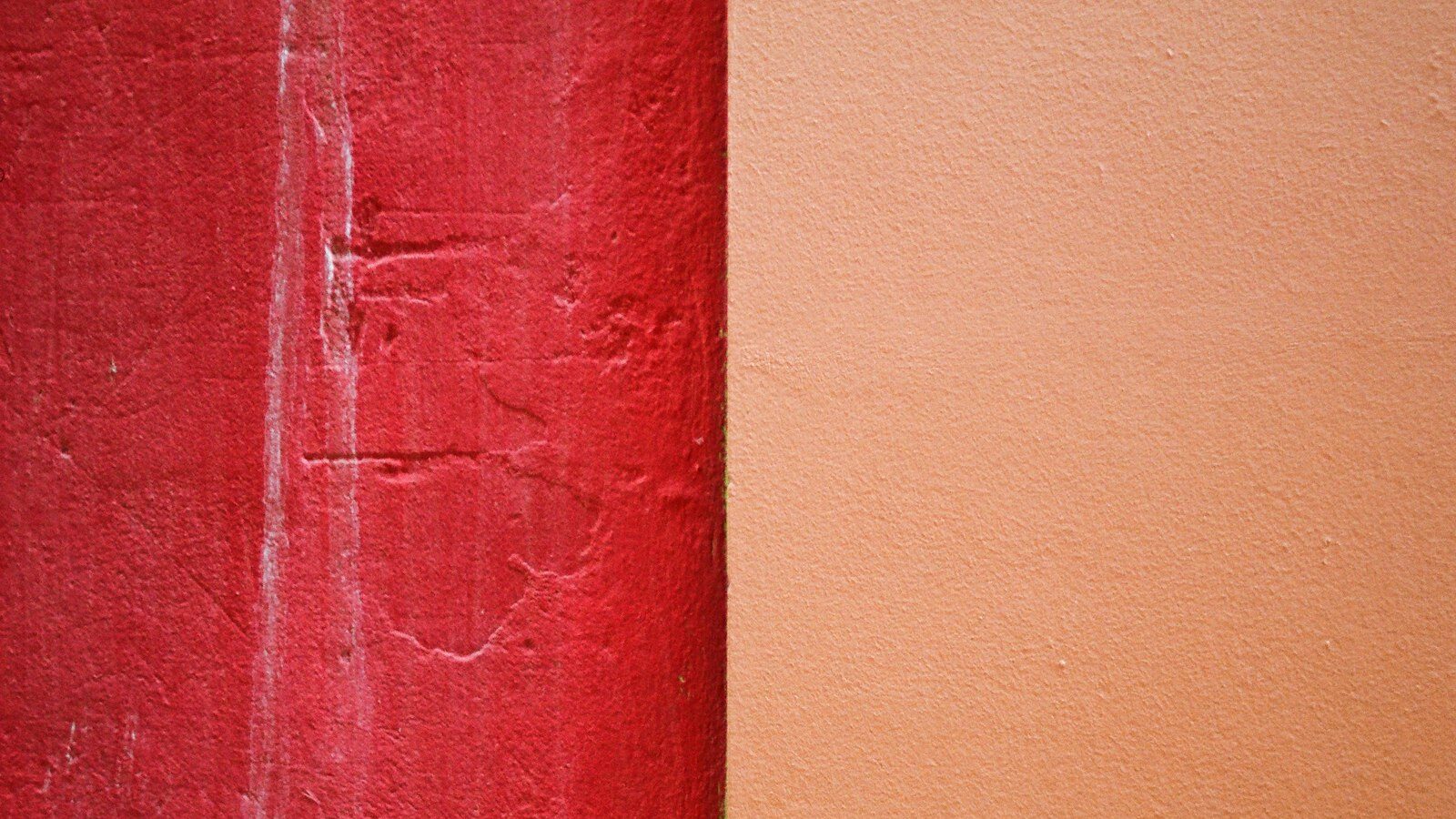 red concrete wall during daytime