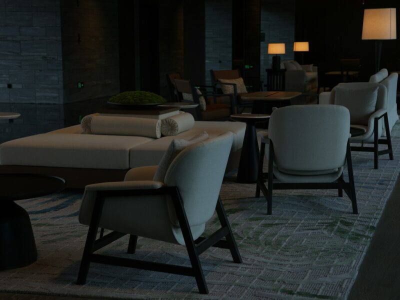 Modern lounge area with comfortable seating and lamps.